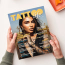 Magazin „Tattoo Life“ mit gelbem Schriftzug und der sichtbaren Ausgabe Nr. 155. Auf dem Cover eine Frau mit langen dunklen Haaren, Nasen- und Ohrpiercings sowie sichtbaren Tattoos am Arm, vor unscharfem Naturhintergrund. Text auf dem Cover unter anderem: „Cover Girl Sahar Founder of Azadi Adornments“, „Neon Surrealism made in the UK by Anthony Lennox“, „In Berlin The Traditional Dames of Sonia Sofia Cash“ und weitere Themen zu Tattoo-Kunst.
