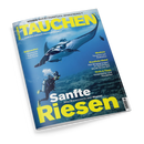 Titelbild der Zeitschrift „TAUCHEN“, Ausgabe Nr. 6 / Juni 2025, mit einer Unterwasserszene: ein*e tauchende Person in vollständiger Tauchausrüstung mit Luftblasen blickt auf einen großen Mantarochen, umgeben von bläulichem Wasser und Korallenboden. Textaufschriften u. a.: „Sanfte Riesen – Alles Wissenswerte über Mantas“, „Reisewelten“, „Medizin“, „Kwazulu-Natal“, „Tests & Tipps“.