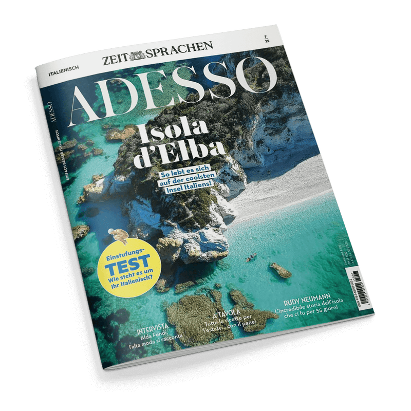 Titelbild der Zeitschrift „ADESSO“ aus der Reihe „ZEIT SPRACHEN“, Ausgabe Nr. 7/25, mit Luftaufnahme eines felsigen Küstenabschnitts der Insel Elba mit türkisfarbenem Wasser und weißen Stränden; Haupttitel „Isola d’Elba“ mit dem Untertitel „So lebt es sich auf der coolsten Insel Italiens!“, dazu gelber Kreis mit der Aufschrift „Einstufungs-TEST – Wie steht es um Ihr Italienisch?“ sowie Hinweise auf Beiträge über Aida Fenidi, italienische Sommerrezepte und Rudy Neumann.