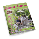 Titelbild der Zeitschrift „Wohnen & Garten“, Ausgabe Juni 2025, mit dem Titel „Willkommen im Sommersalon“; im Zentrum ein gedeckter Holztisch auf einer Terrasse mit sechs Gartenstühlen, umgeben von blühenden Pflanzen, Sonnenschirm und grünem Formschnitt; Textinhalte u. a.: „Garten & Blumen“, „Rosen richtig schneiden, pflegen und düngen“, „Kreative Rezepte mit Kirschen“, „Ideenreich einrichten mit romantischem Rot“ und „Tolle Beete gestalten im englischen Stil“.