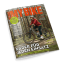 Titelbild der Zeitschrift „MY BIKE“, Ausgabe 3/2025, zeigt eine weiblich gelesene Person mit weißem Helm, roter Jacke und dunkler Hose auf einem grauen E-Bike im Nadelwald; sichtbar sind die Schlagzeilen „Räder für jeden Einsatz“, „20 Seiten Basiswissen zum Fahrradkauf“ sowie Themen u. a. zu Citytrip Lissabon, Frühjahrs-Check, Mozart-Radweg und Tipps für Alltag und Tour.