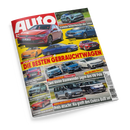 Schräg fotografiertes, glänzendes **AUTO BILD**-Magazincover mit zahlreichen Pkw in Rot, Blau, Gelb, Weiß und Grün auf gelbem, grauem und schwarzem Hintergrund. Sichtbare Texte: „DIE BESTEN GEBRAUCHTWAGEN“, „Zwei kleine Raumwunder jagen den VW Polo“, „Preis-Attacke: Kia greift den Elektro-Bulli an!“, „Erster Test Porsche Cayenne Turbo Electric“ sowie Modellbezeichnungen wie VW Golf, Skoda Octavia, BMW 318d und Mazda MX-5.