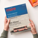 Zwei Hände halten die Zeitschrift „mare – Die Zeitschrift der Meere“, Ausgabe Nr. 169, vor hellem Hintergrund. Titelbild zeigt eine beige Mauer mit rotem Bus im unteren Bereich und blauen Himmel im oberen Teil. Lesbare Aufschriften: „Drei Tage im Südpolarmeer“, „Die Lagune von Venedig“, „Die Klippenspringer von Acapulco“, Haupttitel „Die Mauer – Japans Jahrhundertbauwerk zum Schutz gegen Tsunamis“.