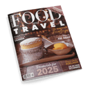 Titelbild der deutschsprachigen Zeitschrift „Food and Travel“ mit weißer und gelber Schrift auf dunklem Hintergrund mit Bokeh-Lichteffekten; zentrale Abbildung zeigt ein Dessert mit Puderzucker in Silberfolie neben einer Schale mit Sorbet und Löffel auf hölzernem Untergrund. Sichtbare Textaufschriften: „Die perfekten Feiertage“, „Resorts am Meer“, „Traumziele für 2025“, „Down Under Adelaide“, „Ab in den Schnee“, „Gourmet Traveller Anguilla Uganda“ und „Gewinnen: Kreta-Trip“.