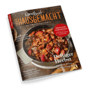 Titelbild des Kochmagazins „Landlust Einfach Hausgemacht“, Ausgabe Nr. 5/2024, mit einer Draufsicht auf einen gusseisernen Bräter mit herbstlichem Eintopf aus Fleischstücken, roten Apfelspalten, Pilzen und Wurzelgemüse, umgeben von Schriftzügen wie „Deftiger Herbst“, „Köstliche Kartoffeln“, „Apfelkuchen“, „Schnelle Küche“ und „Maultaschen“; Hintergrund aus hellem Holz mit Leinentuch, Perspektive leicht schräg von oben.