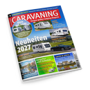 Schräg aufgenommenes, aufgeschlagenes Titelcover des Camping-Magazins „CARAVANING“ mit blau-rotem Layout und großen weißen Schriftzügen „Neuheiten 2027“ sowie „Europas großes Camping-Magazin“. Abgebildet sind mehrere Wohnwagen, ein schwarzes Zugfahrzeug, Landschaften, ein See, ein Schloss und Campinggeschirr; sichtbare Texte nennen unter anderem „Adria Alpina“, „Tabbert Vivaldi“, „Fendt Apero“, „Ratgeber und Zubehör“ und „Urlaub am Wasser“.