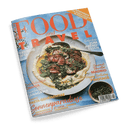 Titelbild der Zeitschrift „FOOD and TRAVEL“, mit großflächigem Foto eines angerichteten Fleischgerichts auf flachem Teller mit hellgelber Soßenbasis, grünem Gemüse und Kräutern, daneben ein Löffel; Schriftzüge u. a.: „Sonnenparadiese“, „Einfaches zum Abendessen“, „Gourmet Traveller Madrid“, „Pasta-Geheimnisse“, „Persische Tafel“ sowie „Gewinnen Sie einen Urlaub in Kroatien“; blaue Hintergrundfläche, Barcode unten rechts.