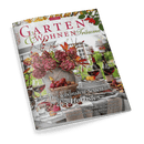 Titelbild der Zeitschrift „Garten & Wohnen Träume“, Ausgabe 5/2024, zeigt herbstlich gedeckten Tisch mit Wein, Kerzen, Obstschale und großer Vase mit Hortensien und buntem Laub vor einem Fenster; Texte auf dem Cover: „Die schönsten Seiten des Herbstes“, „Holunder & Brombeeren: Feine Rezepte mit Früchten der Saison“, „Wohnen-Ideen: Von Country-Küchen bis Gobelin-Accessoires“, „Farbenfrohes Finale: Leuchtende Stauden, Sträucher & Gräser“.