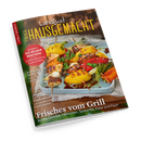Schräg fotografierte Zeitschrift „Landlust Hausgemacht“ mit grün-braunem Cover und dem Text „Mein Magazin für Haus und Küche“. Abgebildet sind gegrilltes Gemüse und Fleischspieße auf einem hellblauen Tablett; sichtbare Aufschriften: „Marmeladen – Neue Lieblingssorten aus Sommerfrüchten“, „So geht’s: Eis selber machen!“, „Schnelles für heiße Tage“ und „Frisches vom Grill“.