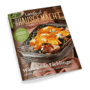 Titelbild der Zeitschrift „Landlust Einfach Hausgemacht“, Ausgabe 1/2025, zeigt einen rechteckigen Ofenauflauf mit orangefarbenem Kürbis, grünem Blattgemüse und überbackenem Käse, davor gestrickter rosa Topflappen auf dunklem Holztisch; Aufschriften u. a.: „Wärmende Lieblinge – Aufläufe, Eintöpfe und Suppen zum Genießen“, „Buchteln & Germknödel – Gefülltes Glück für kalte Tage“, „Sandwiches – Köstlich belegte Brote aus Ofen und Pfanne“.