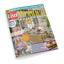 Schräg fotografierte Zeitschrift „Lisa Wohnen & Dekorieren“ auf schwarzem Hintergrund. Das Cover zeigt eine weibliche Person neben einem blühenden Garten, ein helles Esszimmer mit gedecktem Tisch sowie Gebäck; sichtbare Texte: „Kreativ den Sommer verlängern“, „Landhaus-Liebe“, „60 Ideen für ein leichtes Wohngefühl“ und „Dekorieren mit Blumen, Gräsern & Co.“
